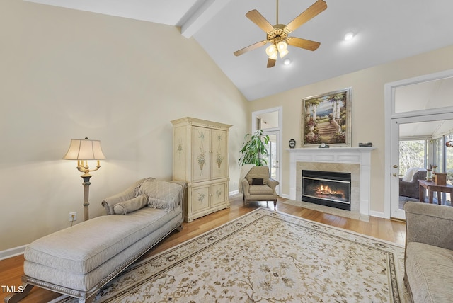 living room with high vaulted ceiling, ceiling fan, beamed ceiling, and light wood-type flooring