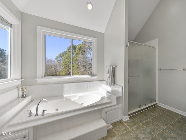 bathroom featuring plus walk in shower, tile patterned flooring, and lofted ceiling