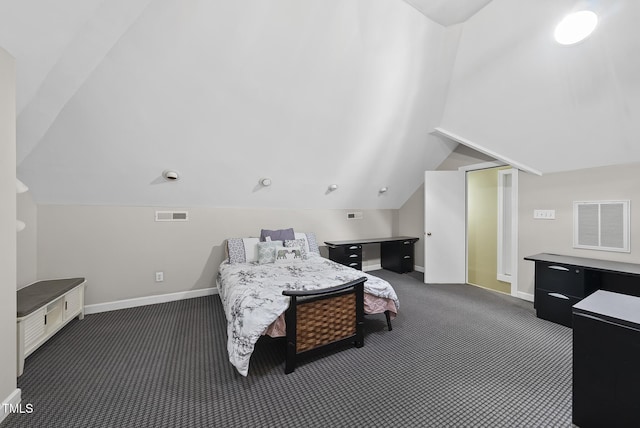 bedroom with dark colored carpet and lofted ceiling