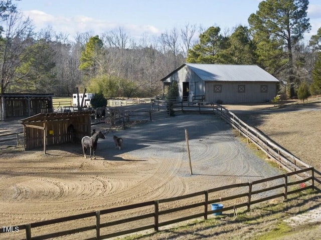 exterior space with a rural view and an outdoor structure