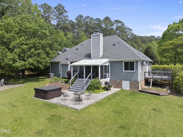 265 Verde Rd, Apex, NC 27523 - back of house with a hot tub, a sunroom, a patio area, roof with shingles, and a yard