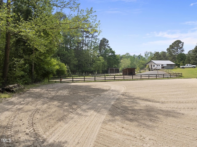 265 Verde Rd, Apex, NC 27523 - view of yard with an enclosed riding area, curved driveway, an outbuilding, and a view of countryside