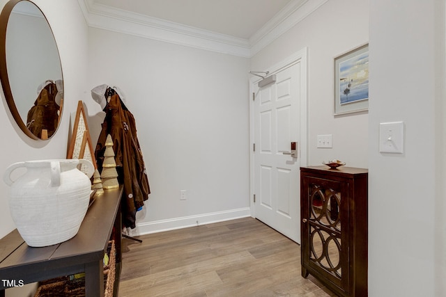 entryway featuring light hardwood / wood-style flooring and crown molding