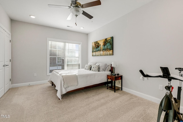 carpeted bedroom with ceiling fan