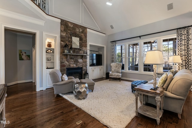 living room with a fireplace, dark hardwood / wood-style floors, built in features, ornamental molding, and high vaulted ceiling