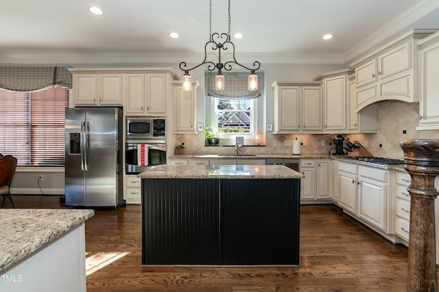 kitchen with pendant lighting, a center island, light stone countertops, stainless steel appliances, and dark hardwood / wood-style flooring