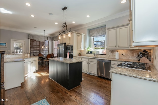 kitchen featuring a kitchen island, dark hardwood / wood-style flooring, stainless steel appliances, tasteful backsplash, and hanging light fixtures