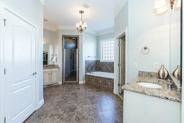 bathroom with independent shower and bath, vanity, crown molding, and a chandelier