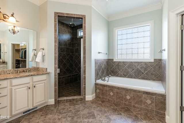 bathroom featuring a notable chandelier, independent shower and bath, tile patterned floors, crown molding, and vanity