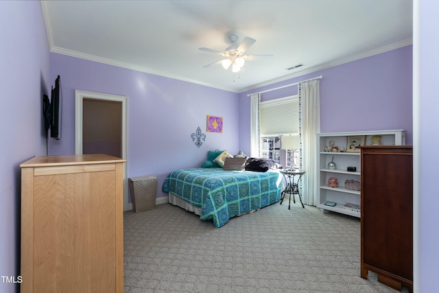 carpeted bedroom featuring ceiling fan and ornamental molding