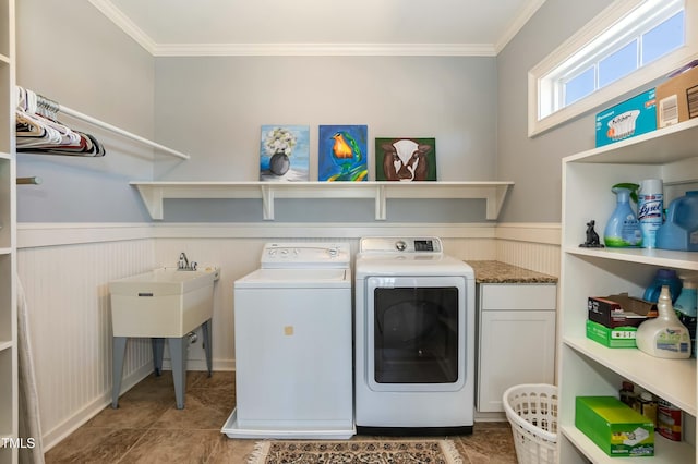 laundry room featuring cabinets, washer and clothes dryer, ornamental molding, and tile patterned flooring