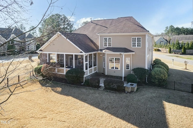 view of front of home featuring a sunroom