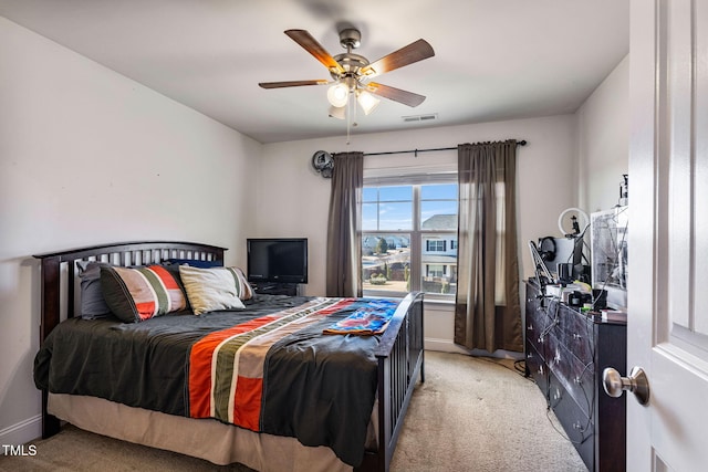 carpeted bedroom featuring ceiling fan