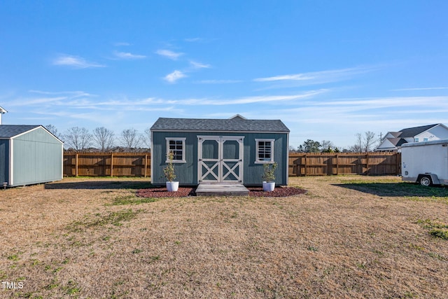 view of outdoor structure with a lawn