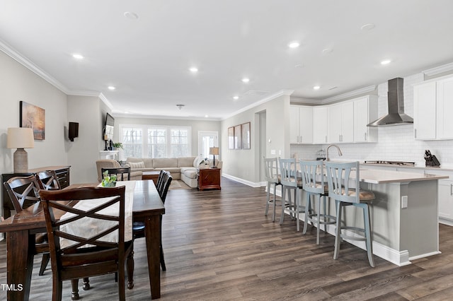 dining room with dark hardwood / wood-style floors and ornamental molding