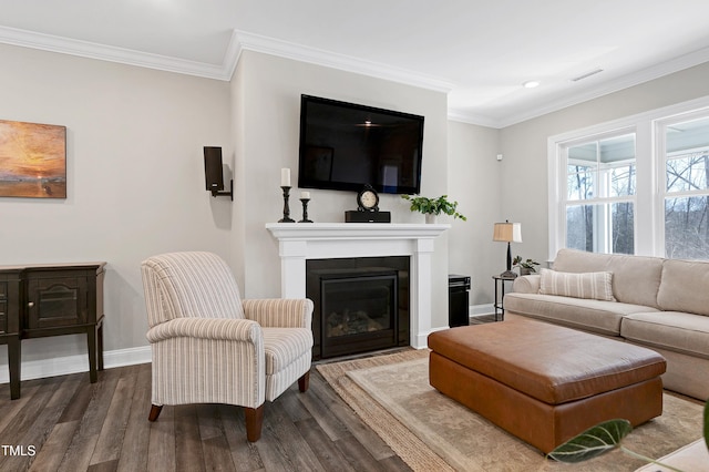 living room with hardwood / wood-style flooring and ornamental molding