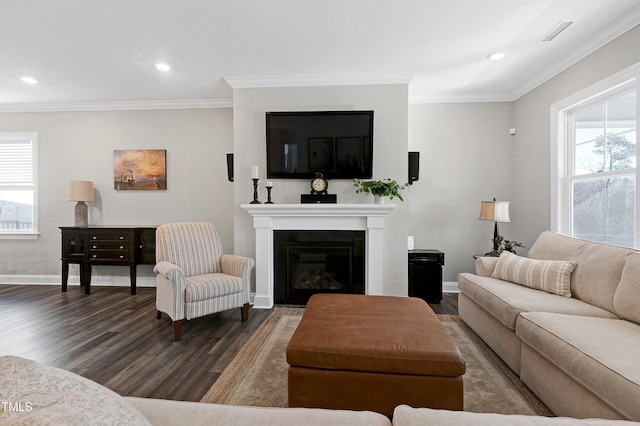 living room with dark hardwood / wood-style floors and crown molding