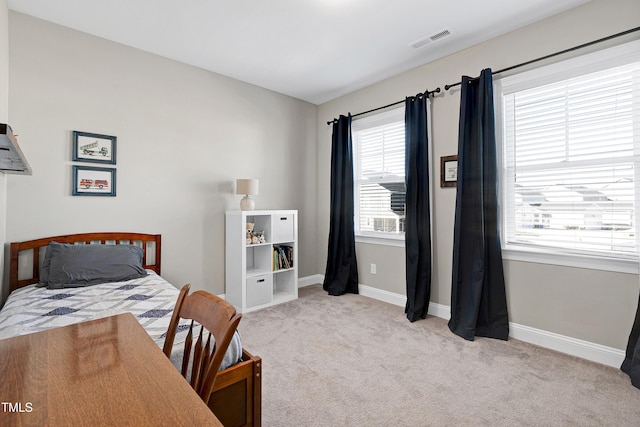 bedroom featuring light colored carpet