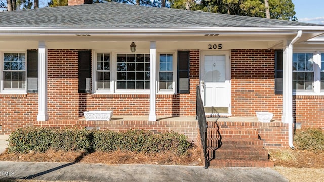 doorway to property with a porch