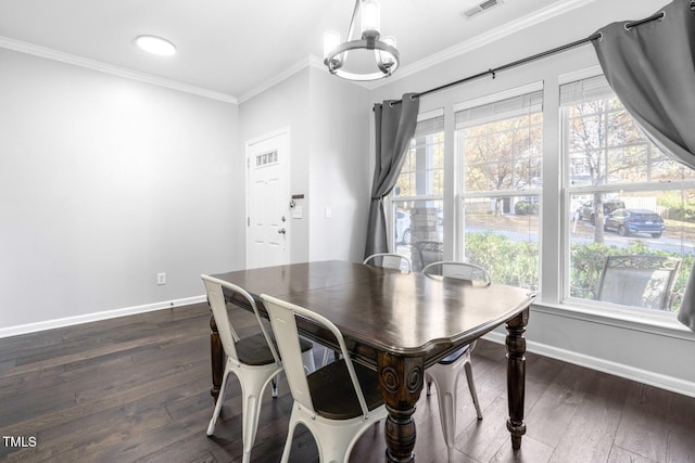 dining room featuring a chandelier, ornamental molding, and dark hardwood / wood-style floors