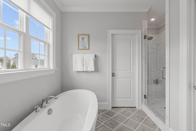 bathroom with independent shower and bath and ornamental molding