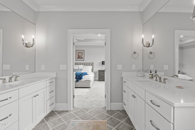 bathroom with ornamental molding and vanity