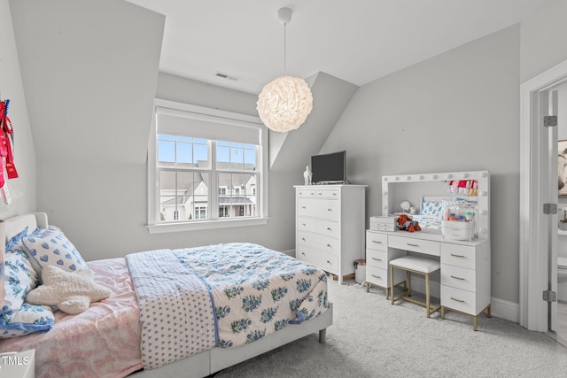 carpeted bedroom featuring lofted ceiling