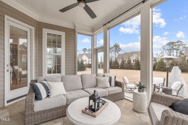 sunroom with ceiling fan