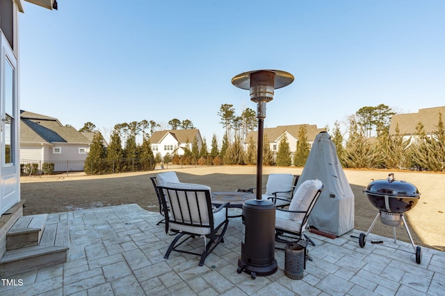 view of patio featuring a grill