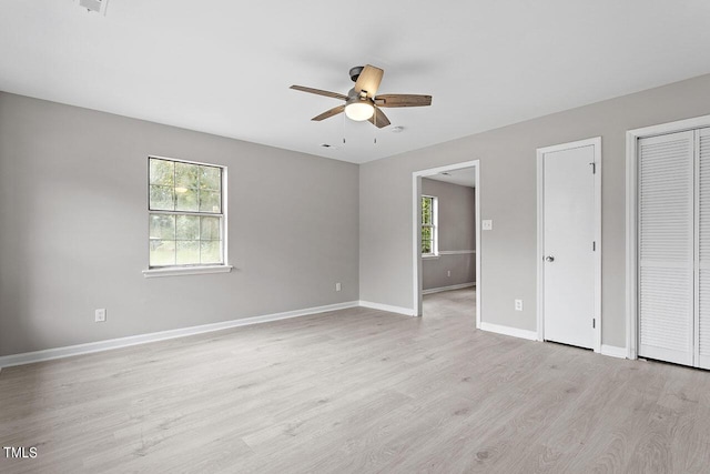 unfurnished bedroom featuring light hardwood / wood-style flooring and ceiling fan