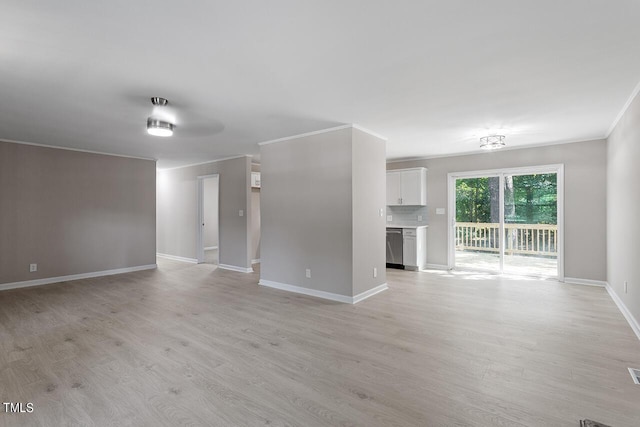 unfurnished living room with light hardwood / wood-style floors and crown molding