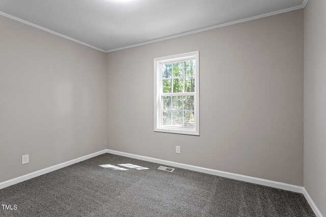 carpeted spare room featuring ornamental molding