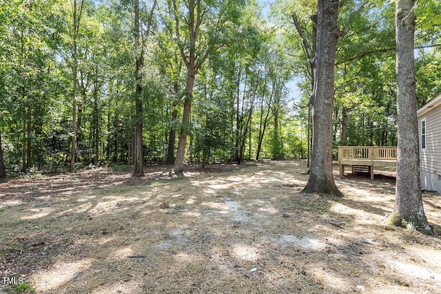 view of yard with a deck