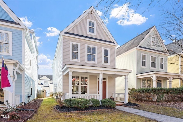 front of property featuring a front lawn and a porch