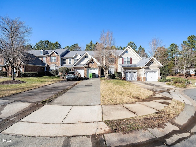 view of front facade with a garage and a front yard