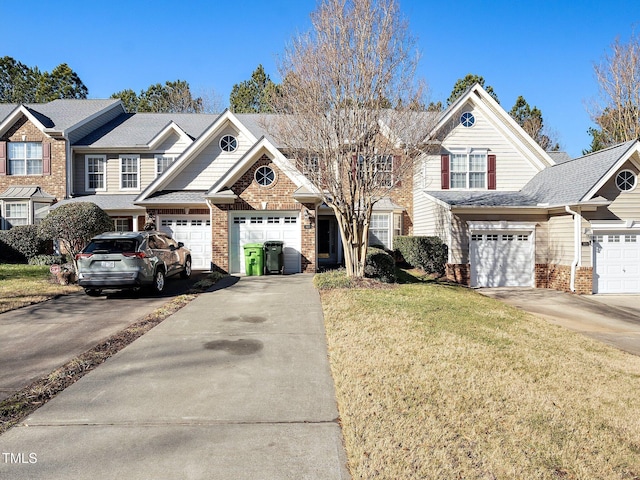 view of front of house with a garage and a front yard