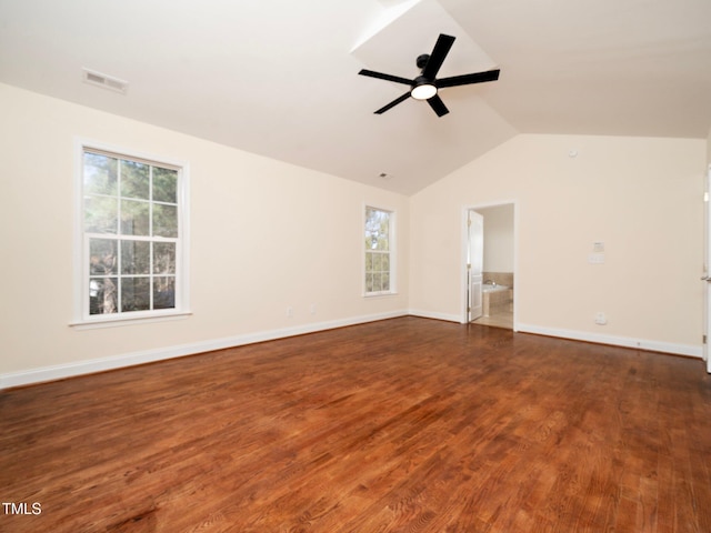 unfurnished room featuring ceiling fan, dark hardwood / wood-style floors, and vaulted ceiling