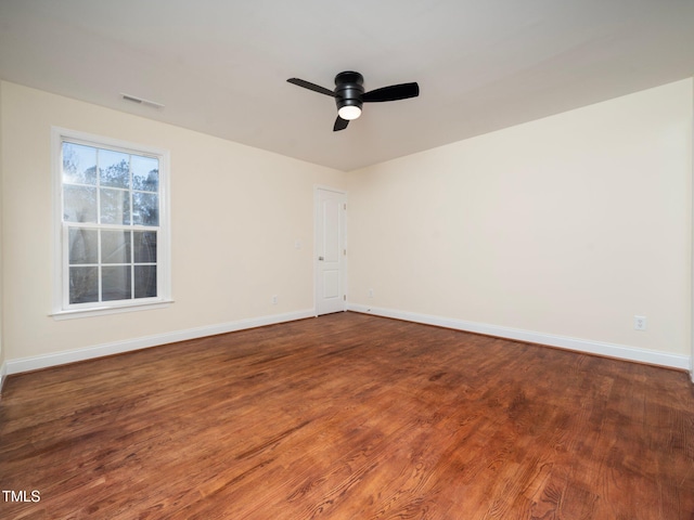 spare room featuring ceiling fan and hardwood / wood-style floors