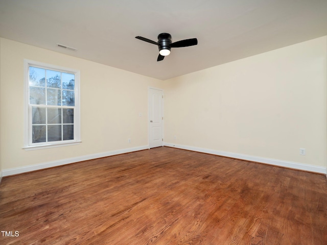 empty room with wood-type flooring and ceiling fan