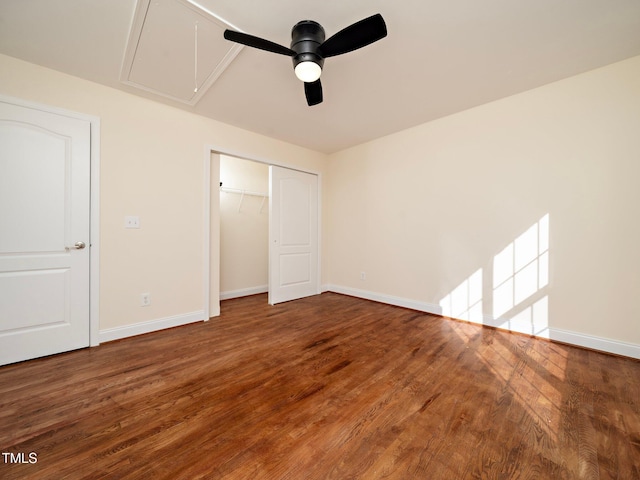 unfurnished bedroom with hardwood / wood-style floors, ceiling fan, and a closet