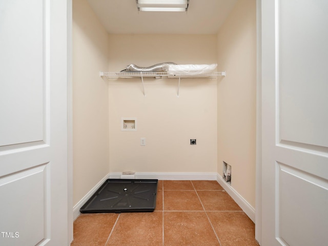 laundry area featuring hookup for an electric dryer, hookup for a washing machine, and light tile patterned floors