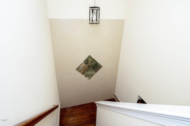 staircase featuring hardwood / wood-style flooring