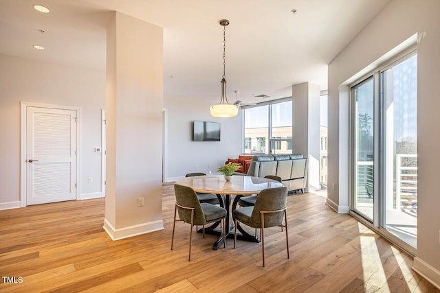 dining space with light wood-type flooring