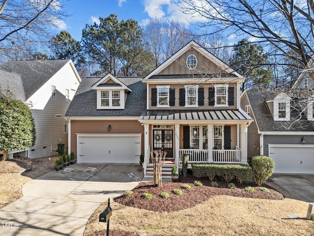 view of front facade with a porch and a garage