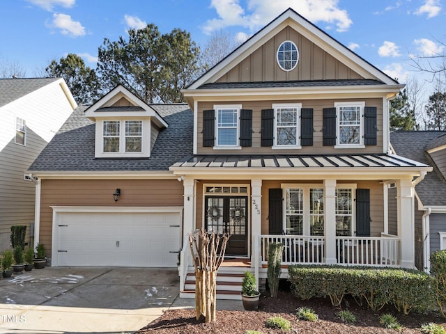 view of front of home featuring covered porch and a garage