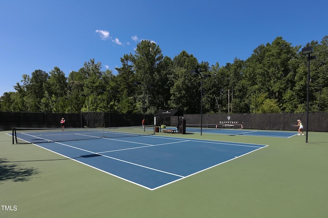 view of sport court featuring community basketball court and fence