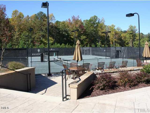 view of tennis court with fence