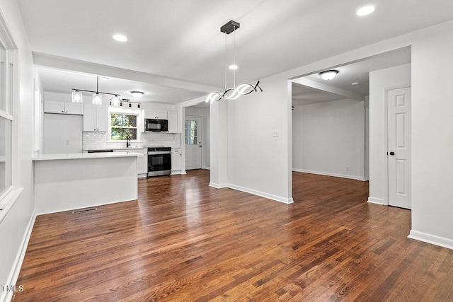 interior space featuring dark hardwood / wood-style flooring and sink