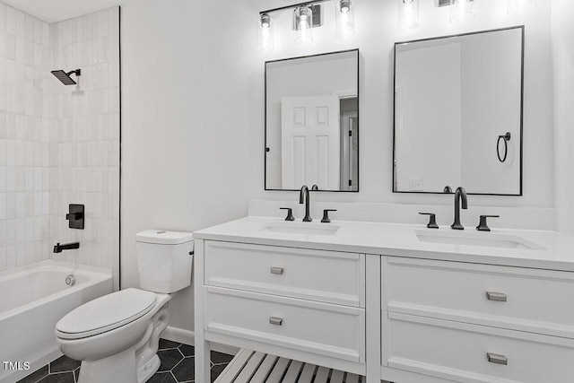 full bathroom with vanity, tile patterned floors, tiled shower / bath combo, and toilet