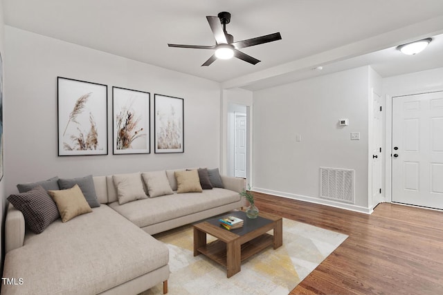 living room with ceiling fan and hardwood / wood-style floors